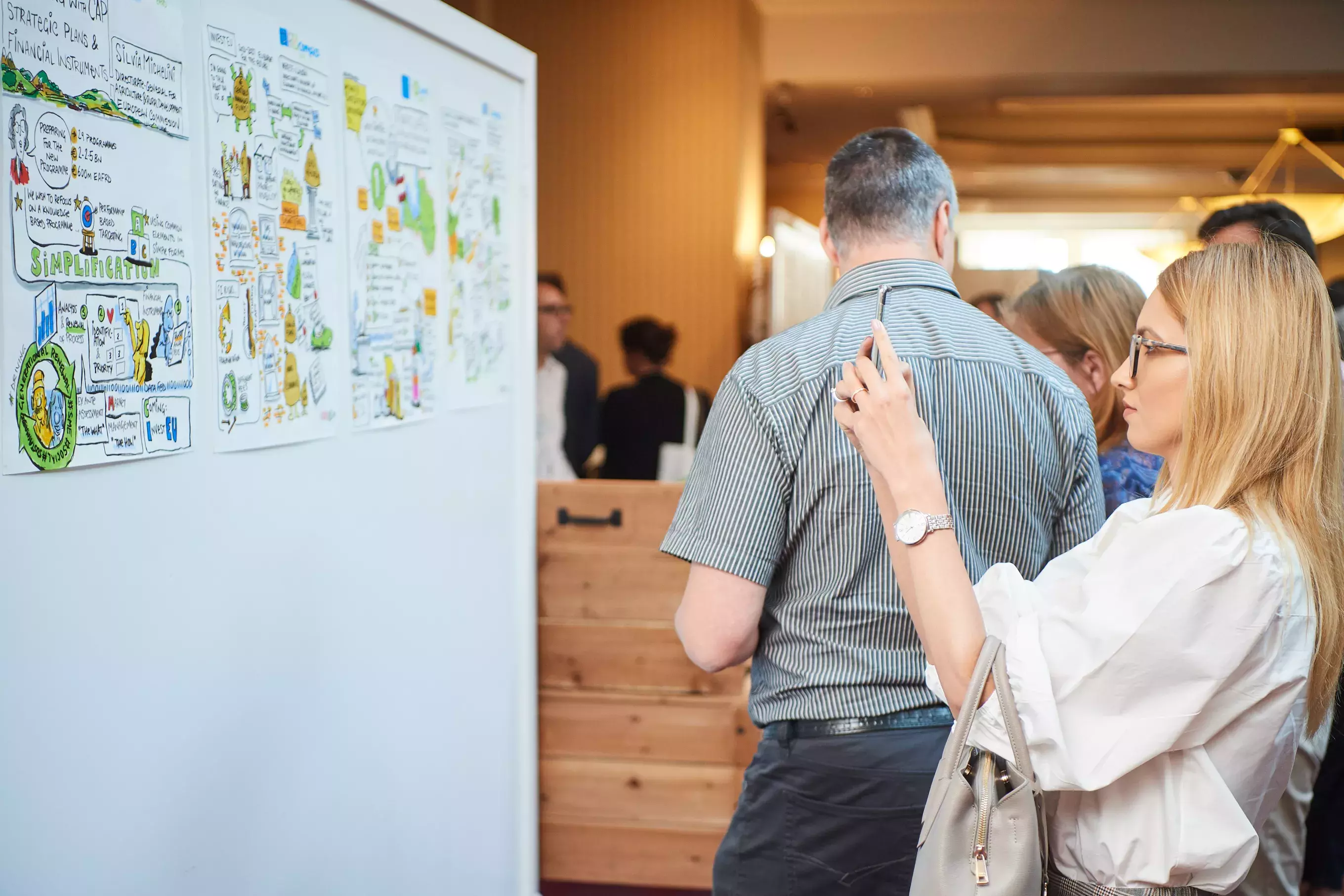 Event participant having a look at illustrations