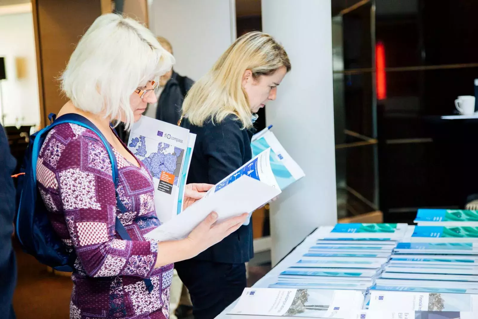 Event participants selecting fi-compass publications