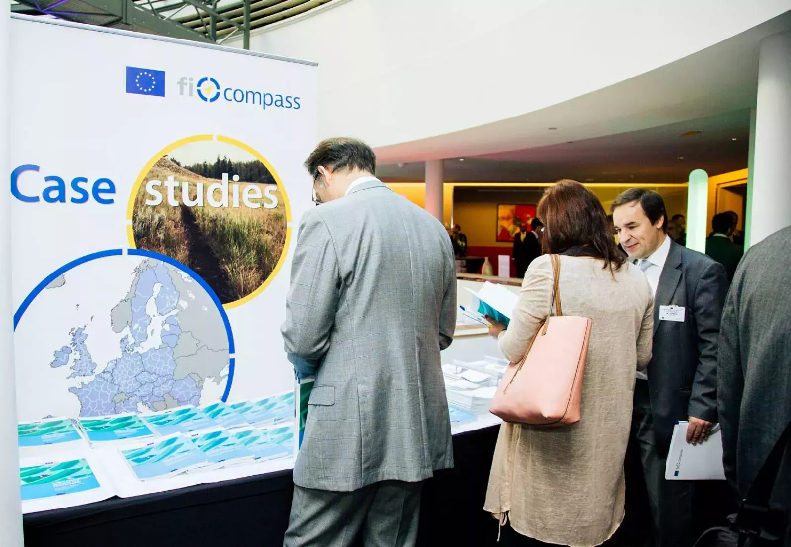 Event participants selecting fi-compass publications