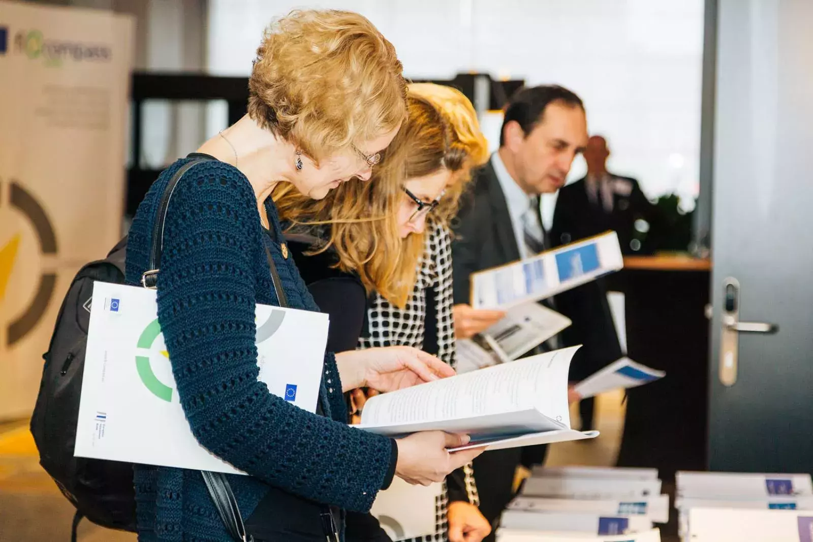 Event participants selecting fi-compass publications