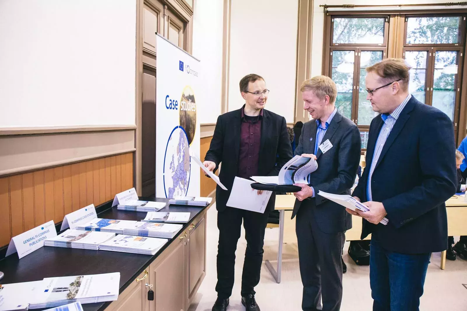 Event participants selecting fi-compass publications