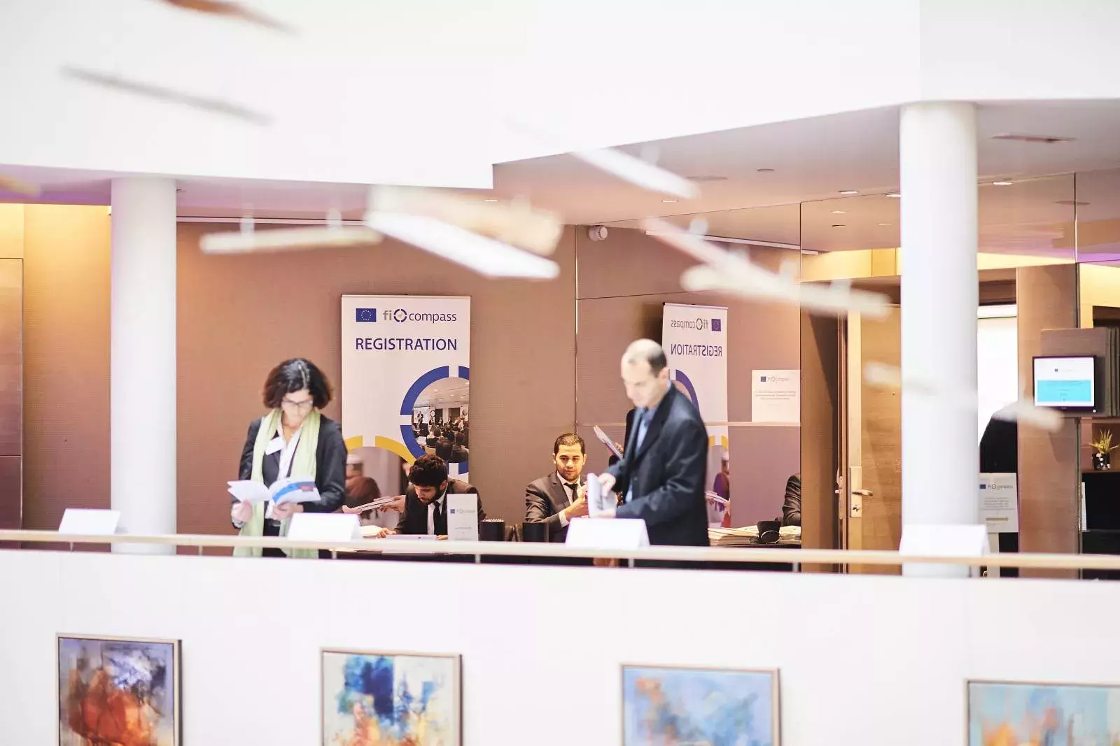 Event participants selecting fi-compass publications