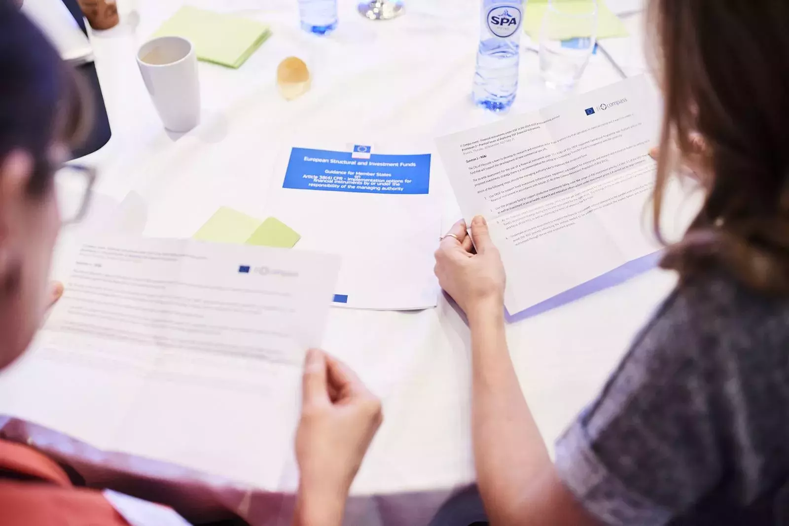 Participants working in groups on brain teasers