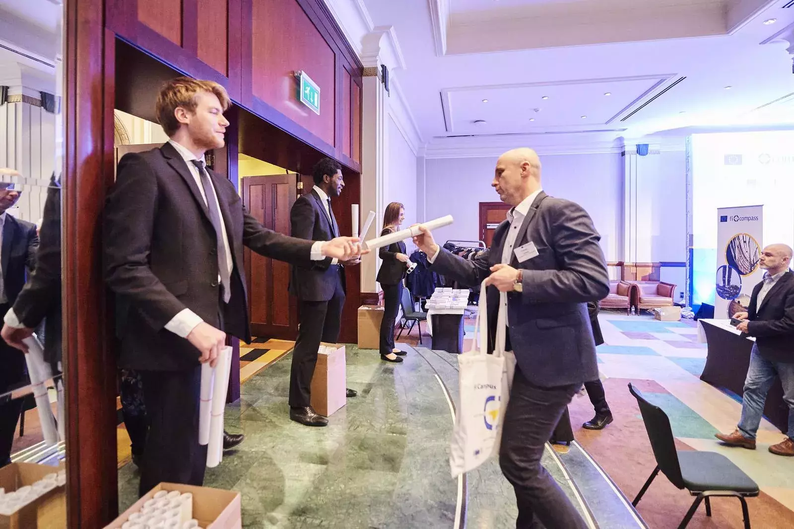 Participans receiving the FI Campus poster