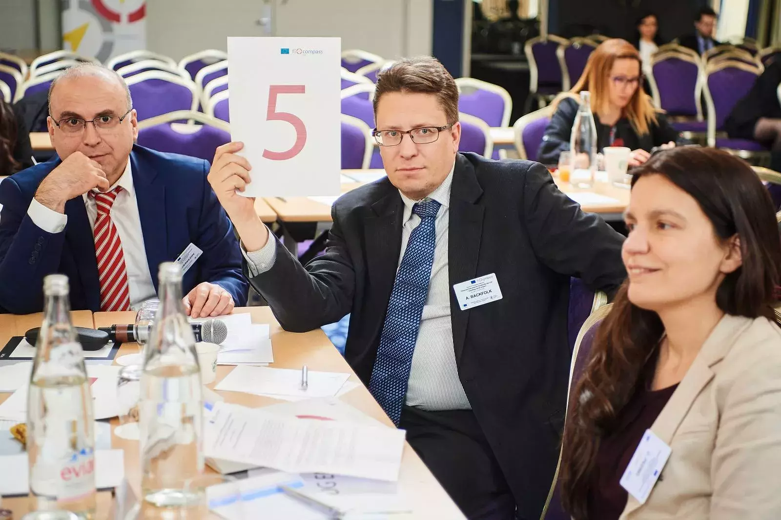 Participants working in groups on brainteasers