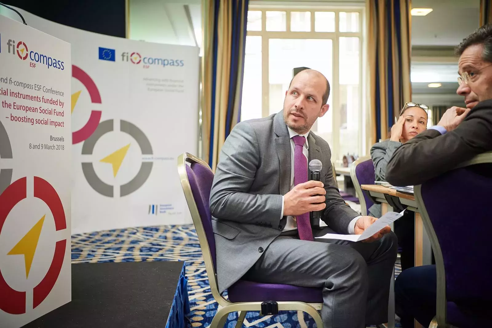 Participants working in groups on brainteasers