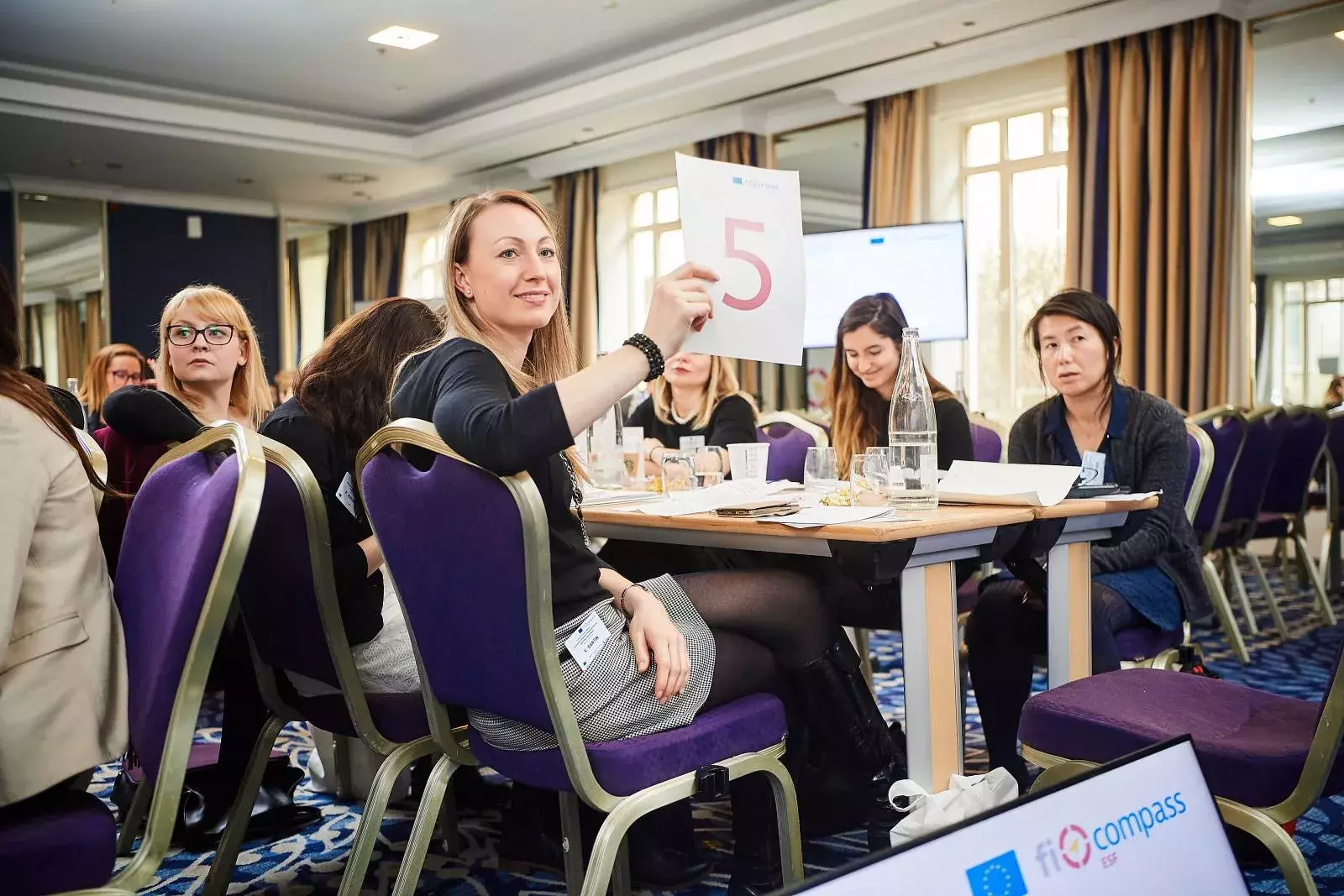 Participants working in groups on brainteasers