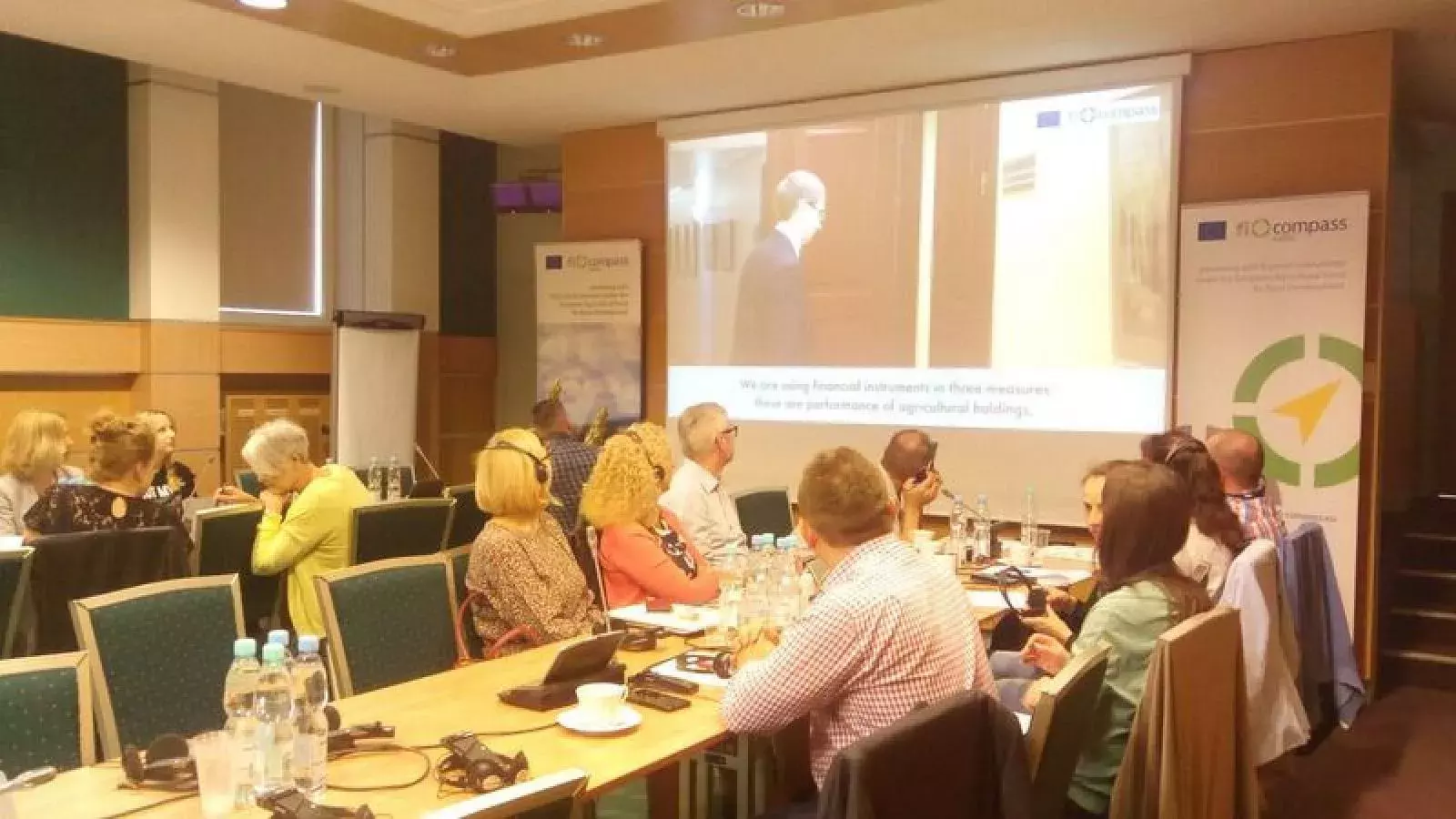 Participants watching a fi-compass case study video