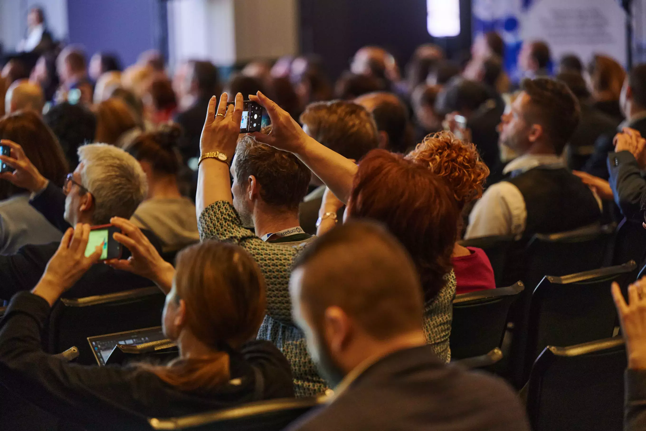 Event participants taking pictures