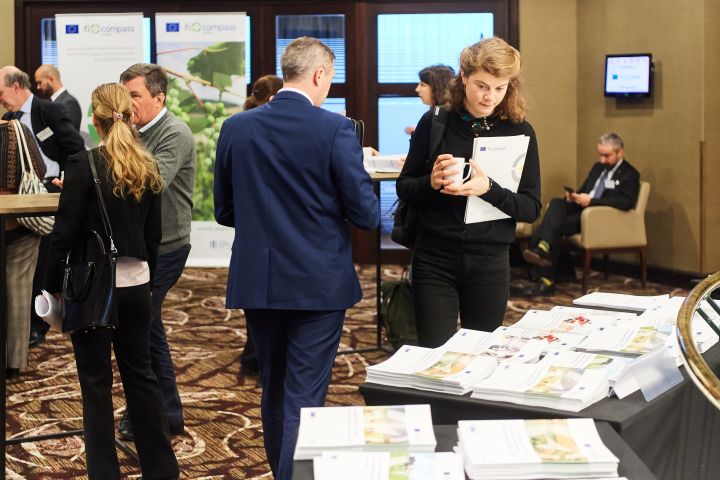 Event participant selecting fi-compass publications