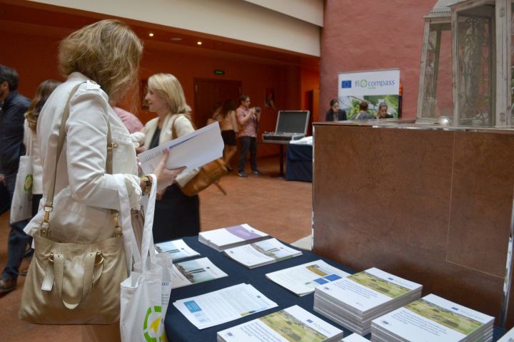 Workshop participant selecting fi-compass publications