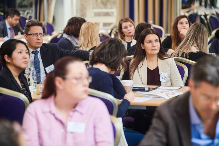 Participants working in groups on brainteasers