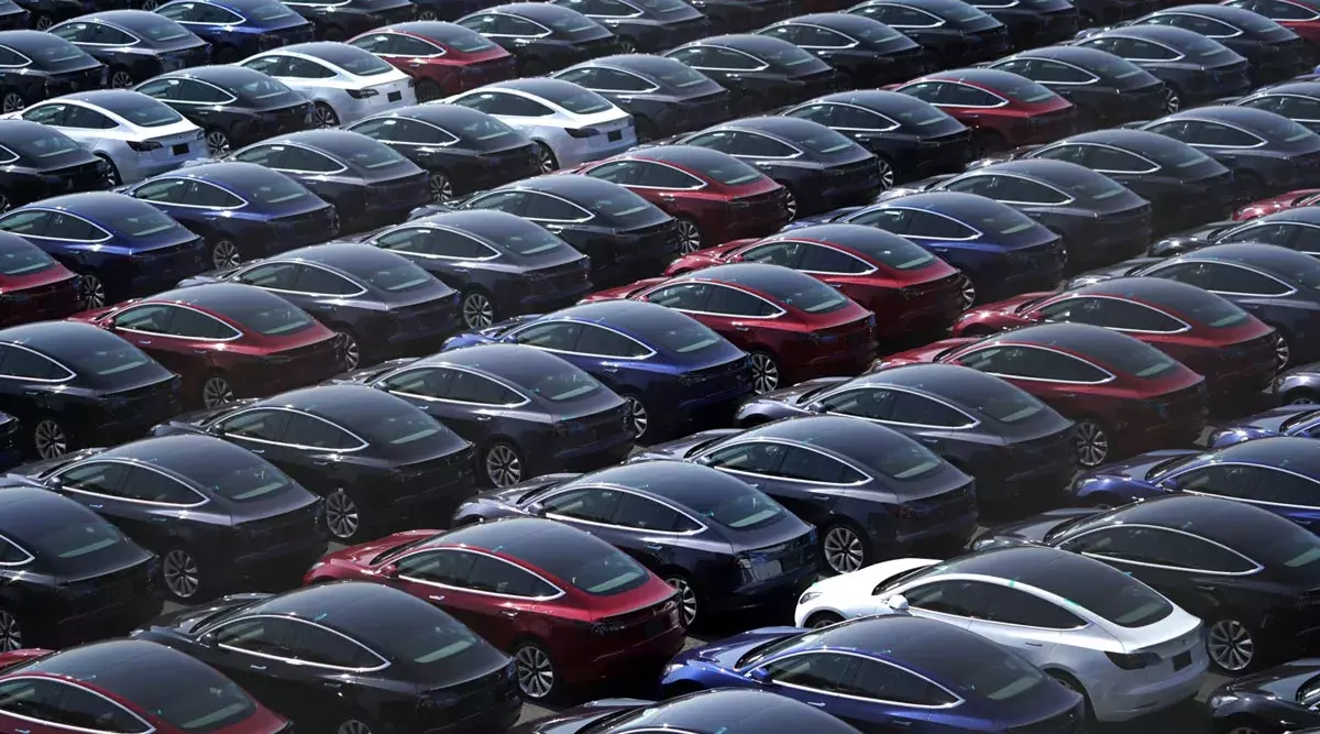 Tesla cars in a parking Tesla cars in a parking